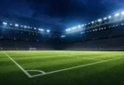ナイターのサッカースタジアムとピッチ