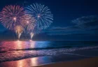 夏の夜、海辺で打ち上がる花火の写実的な情景。人物・文字なし