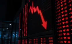 証券取引所の株価電光掲示板、下落を示すイメージ