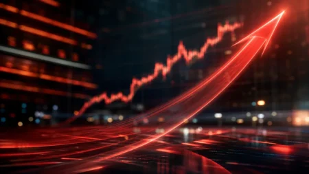株価の急上昇を示す赤い光の上昇矢印と株価チャートの抽象イメージ