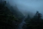 霧に包まれた山岳登山道を進む人影のイメージ