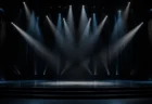 スタジオのステージ、スポットライトが交差する演出のイメージ