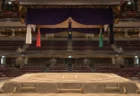 照明に照らされた無人の相撲の土俵と吊り屋根