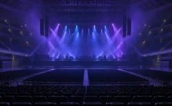 紫と青の照明に照らされた開演前のアリーナのステージと客席